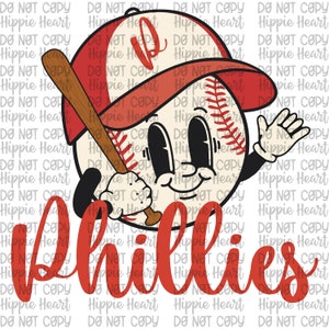 May include: A cartoon baseball with a red hat and a bat, wearing a smile. The baseball is holding the bat in its right hand and waving with its left hand. The word "Phillies" is written in red cursive below the baseball.