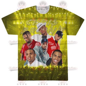 May include: A yellow t-shirt with a graphic print of Chris Brown and other people. The text "Chris Brown" is printed in large, bold letters across the front of the shirt.
