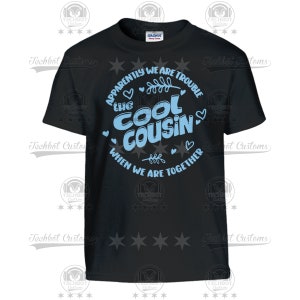 May include: Black t-shirt with a blue graphic that says "Apparently we are trouble the cool cousin when we are together".