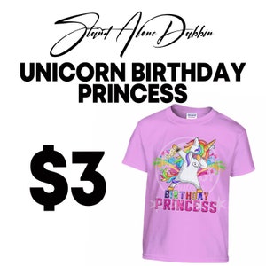 May include: Pink t-shirt with a unicorn dabbing and holding a birthday cake. The unicorn is rainbow colored and has a white horn. The text on the shirt says "Birthday Princess".