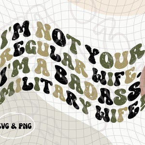 May include: A black and green graphic design with the text "I'm not your regular wife, I'm a badass military wife".