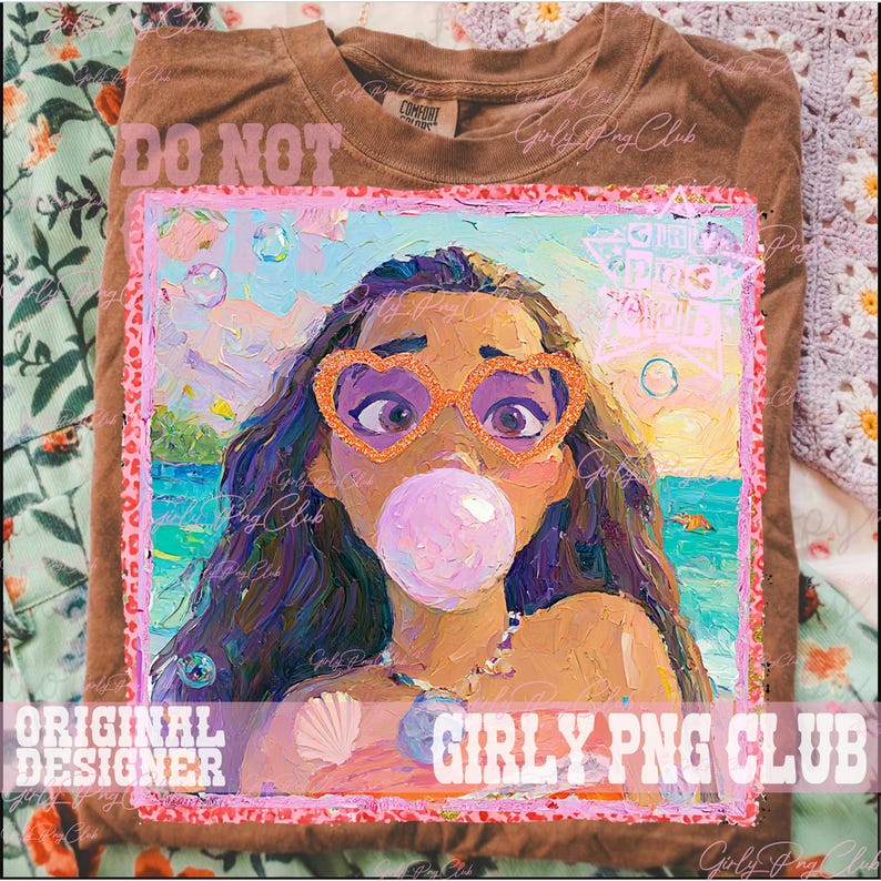 May include: Brown t-shirt featuring a colorful graphic of a woman wearing heart-shaped sunglasses and blowing a bubble. The artwork has a painterly style with vibrant colors and the text "Girly Png Club".