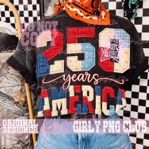 May include: Dark gray t-shirt with a patriotic design. The shirt features the number "250" in red, white, and blue patches, with the word "years" and "AMERICA" below. The text "ORIGINAL DESIGNER" and "GIRLY PNG CLUB" are also visible.