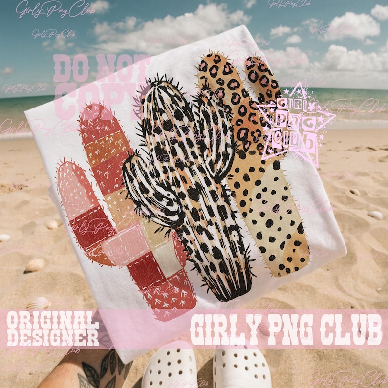 May include: White t-shirt featuring a cactus design with leopard print and patchwork elements. The design includes the text "DO NOT COPY" and "ORIGINAL DESIGNER GIRLY PNG CLUB". The shirt is displayed on a sandy beach.