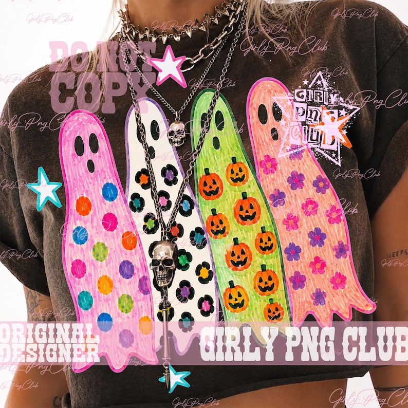 May include: A dark gray t-shirt featuring a graphic of four colorful ghosts. The first ghost has polka dots, the second has leopard print, the third has pumpkins, and the fourth has flowers. The shirt includes layered silver chain necklaces with skull charms.