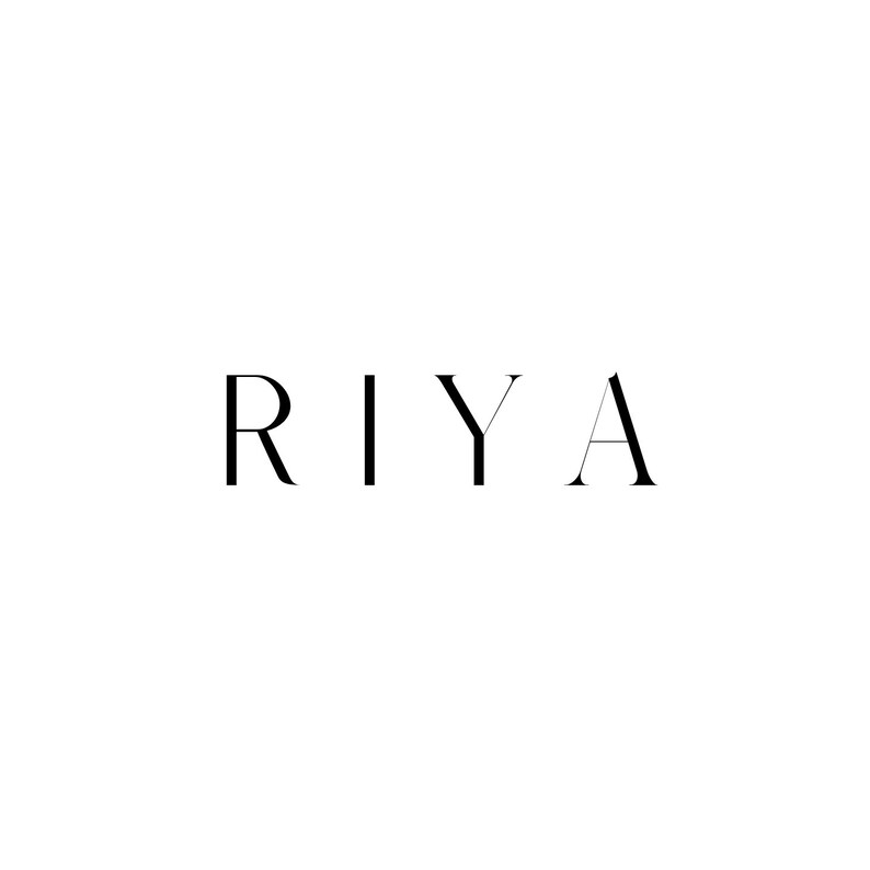 May include: The name "RIYA" written in a simple, modern font.
