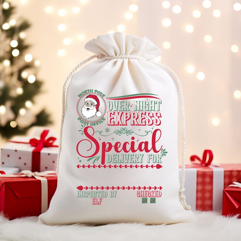 May include: White canvas gift bag with red and green text that reads "North Pole Post Office Over-Night Express Special Delivery For Inspected By Elf Checked". The bag has a drawstring closure and a small illustration of Santa Claus.
