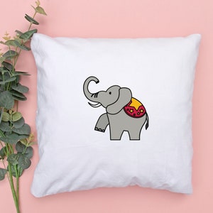 May include: White pillowcase with a cartoon illustration of a gray elephant wearing a red and yellow circus costume.