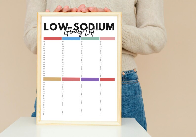 May include: A printable grocery list with the title "LOW-SODIUM Grocery List" in black text. The list is divided into four columns with colored lines at the top of each column. The list is ready to be filled in with groceries.