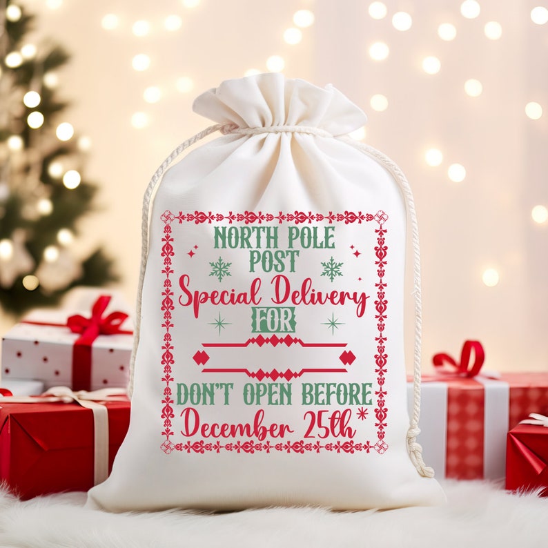May include: White canvas gift bag with red and green embroidery. The bag says "North Pole Post Special Delivery For Don't Open Before December 25th".