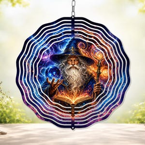 May include: A decorative wind spinner featuring a wizard with a long white beard, holding a glowing orb and staff. The wizard is depicted in a blue robe and hat, with an open book. The spinner has a wavy, layered design with a chain for hanging.