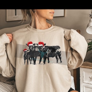 Cattle Merry Christmas Black Angus Cattle with Santa Hat. Cow Lovers, Cattle, Black Angus Cattle,  Sweatshirt, Water mark will be removed,