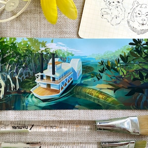 May include: A white paddle steamer with a red roof and a smokestack is sailing through a green swamp. The boat is surrounded by lush green trees and foliage. The water is a deep blue colour.