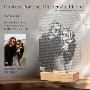 May include: A custom portrait on an acrylic plaque with a wooden stand. The plaque features a black and white photo of a couple with text that reads "ut I can try for your heart. Our dreams, and they are made out of real things. ox of photographs. With sepia-toned loving. Love is the answer, at least for questions in my heart. Like why are we here? And where do we go? And now..."