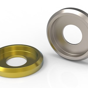 May include: Two circular metal washers with a beveled edge and a central hole. One washer has a polished gold finish, while the other is positioned upright and features a smooth, reflective silver finish. Both components are circular in shape.