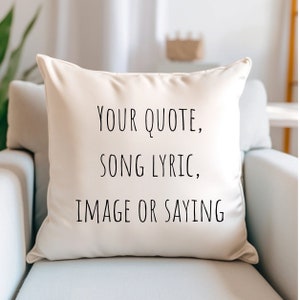 May include: A white throw pillow with black text that reads "YOUR QUOTE, SONG LYRIC, IMAGE OR SAYING".