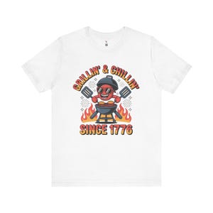 Maglietta unisex "Grigliare e rilassarsi dal 1776" - Perfetta per le feste estive e il Giorno dell'Indipendenza, divertente maglietta regalo per grigliate, orgoglio americano
