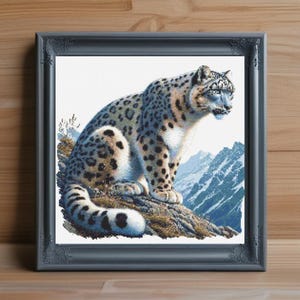 May include: A white and gray snow leopard with black spots sits on a rock with a snowy mountain background.