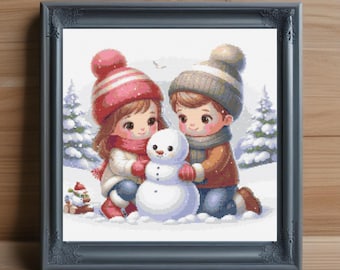 May include: Two children, a girl wearing a red and white hat and a boy wearing a blue hat, build a snowman together in the snow. The girl is holding a carrot for the snowman's nose.