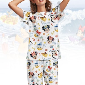 May include: A set of three ceramic mugs with a speckled, matte finish. The mugs are in shades of cream, light grey, and dark grey. Each mug has a simple, minimalist design, ideal for coffee or tea.