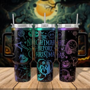 May include: Three stainless steel tumblers with lids and straws. The tumblers feature a black background with a colourful design inspired by the movie "The Nightmare Before Christmas". The text "The Nightmare Before Christmas" is printed on the tumblers.