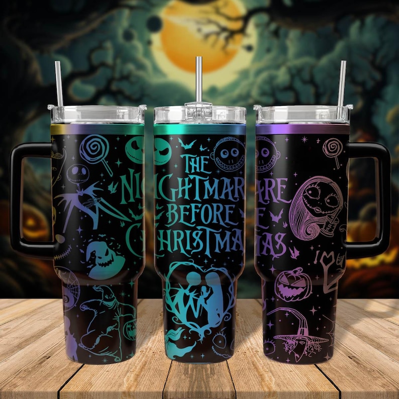 May include: Three stainless steel tumblers with lids and straws. The tumblers feature a black background with a colourful design inspired by the movie "The Nightmare Before Christmas". The text "The Nightmare Before Christmas" is printed on the tumblers.