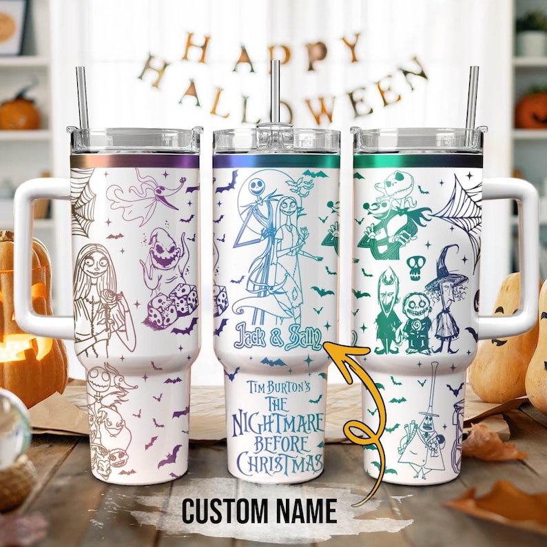 May include: Three white stainless steel tumblers with lids and straws. The tumblers feature a colorful design of characters from the movie "The Nightmare Before Christmas". The text "Jack & Sally" and "Tim Burton's The Nightmare Before Christmas" are printed on the tumblers.