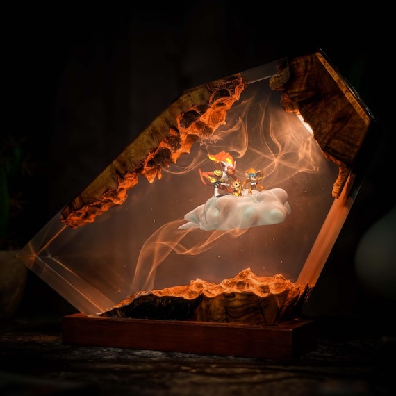 Infernape erupts from an epoxy wood slab glowing with LED light — a genuinely striking piece of Pokemon fan art that's also functional lighting.