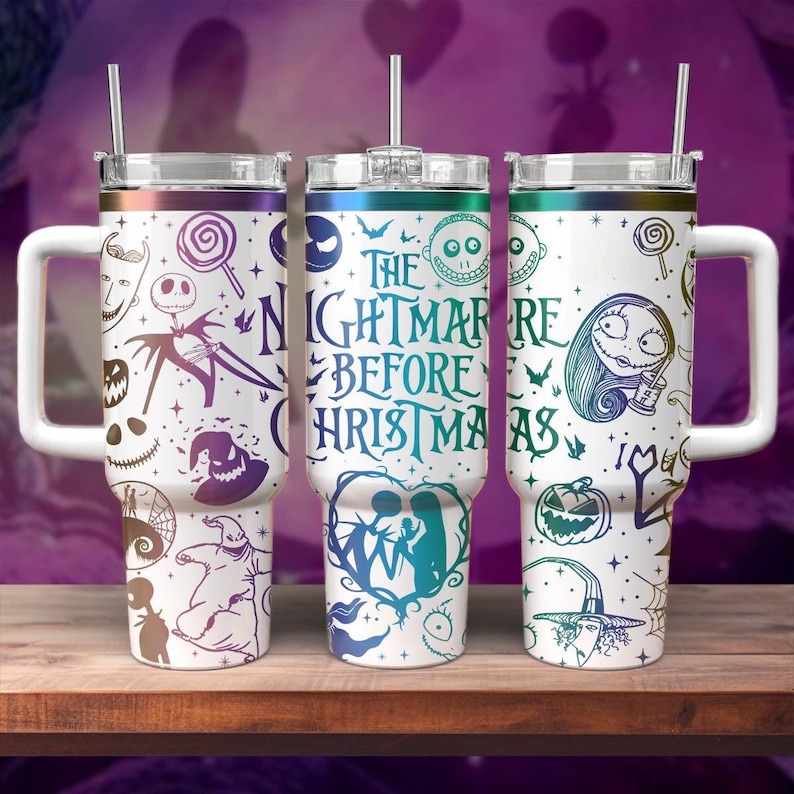 May include: Three stainless steel tumblers with a white background and colourful designs featuring characters from the movie The Nightmare Before Christmas. The tumblers have a handle and a lid with a straw.