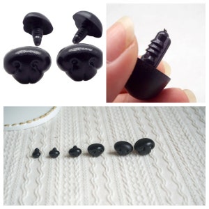 May include: Assortment of black plastic safety eyes with a screw-on back for plush toy making. The eyes come in various sizes, from small to large.