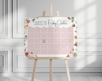 May include: A pink floral baby shower game with a calendar to guess the arrival date of Baby Carter. The calendar has the days of the week and numbers 1-31. The due date is marked on the calendar.
