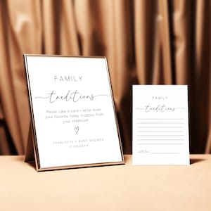 May include: Two white cards with black text that reads "FAMILY traditions". The card on the left has instructions to write down a favorite family tradition from childhood. The card on the right has lines for writing. Both cards are on a brown surface.