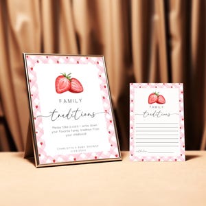 May include: Two pink and white gingham cards with a strawberry illustration and the text "FAMILY traditions". The larger card has instructions to write down a favorite family tradition from childhood. The smaller card has lines for writing.