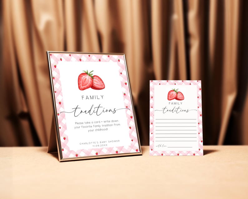 May include: Two pink and white gingham cards with a strawberry illustration and the text "FAMILY traditions". The larger card has instructions to write down a favorite family tradition from childhood. The smaller card has lines for writing.