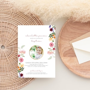 May include: A baptism invitation with a floral border and a photo of a young girl wearing a flower crown. The text reads "charlotte jensen invites you to witness her baptism" and includes the date, time, and location of the event. It also mentions a luncheon at the Jensen's residence following the baptism.