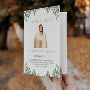 May include: A white Easter Sunday Sacrament Meeting card with gold text and a drawing of Jesus. The card is decorated with green leaves and the text reads "Willow Ward" and "Sunday 21st April 2024 10:00AM".