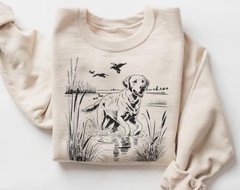 Sudadera de cuello redondo con estampado de labrador retriever, ideal para cazar patos y actividades al aire libre.