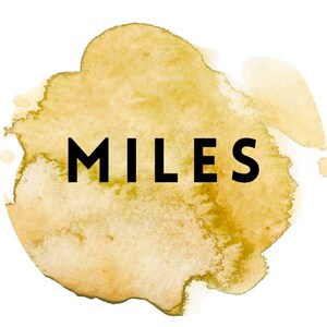 May include: A watercolor-style illustration of a yellow and brown splatter with the word "MILES" in black text.