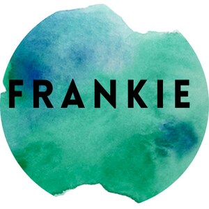 May include: A watercolor background with the word "FRANKIE" in black text.