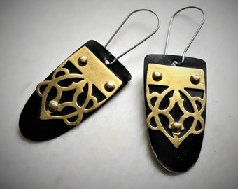 Earrings made from a vintage tin can with a brass tip