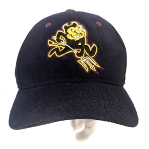 May include: A black baseball cap featuring an embroidered logo of a cartoon devil holding a trident in yellow and maroon.