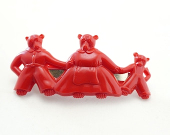 Pinza para el cabello de plástico rojo vintage con diseño de familia de osos, años 50.