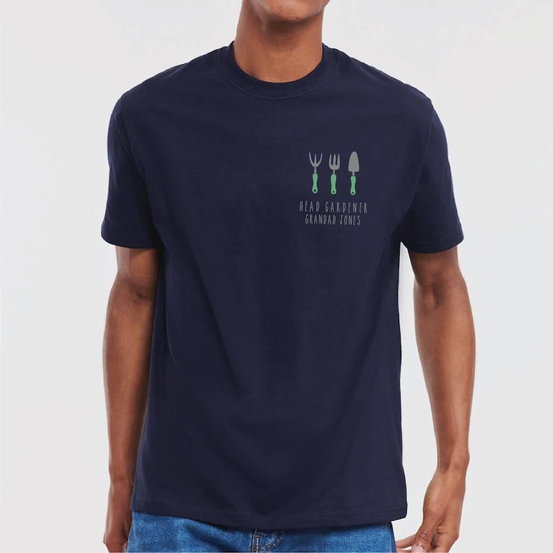 May include: A navy blue t-shirt with a graphic of gardening tools and the text "Head Gardener Grandad Jones".