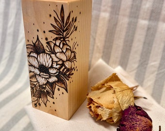 Floral design on wooden candlestick