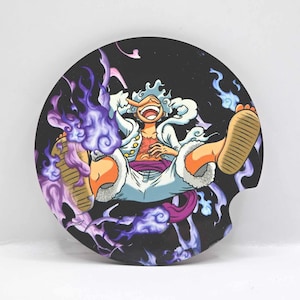 May include: A round black and white coaster with a cartoon image of a character with white hair and a white and red outfit. The character is surrounded by purple and blue flames.