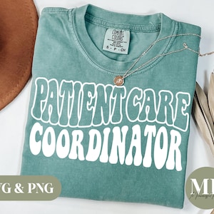 May include: A teal blue t-shirt with the text "PATIENT CARE COORDINATOR" in white, retro-style lettering. The shirt is made of a soft, comfortable material and has a distressed look.