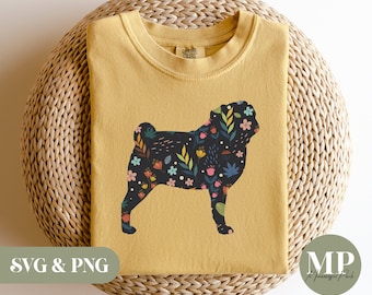 May include: A mustard yellow t-shirt with a floral pug silhouette design. The pug is black with a floral pattern in shades of pink, blue, green, and yellow. The text "Cotton Colors" is printed on the shirt.