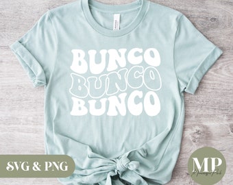 May include: A light blue t-shirt with the text "BUNCObuncobunco" in white, retro-style lettering. The shirt is tied in a knot at the bottom. The text "SVG & PNG" is in the lower left corner of the image. The text "MP" is in the lower right corner of the image.