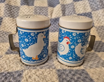 2 Metal Vintage Salt And Pepper Shakers / Pots With Handles Ducks And Chickens