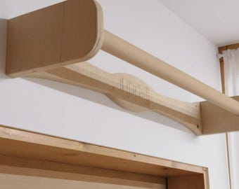 Wooden pull-up bar, wall-mounted, above the door, natural wood